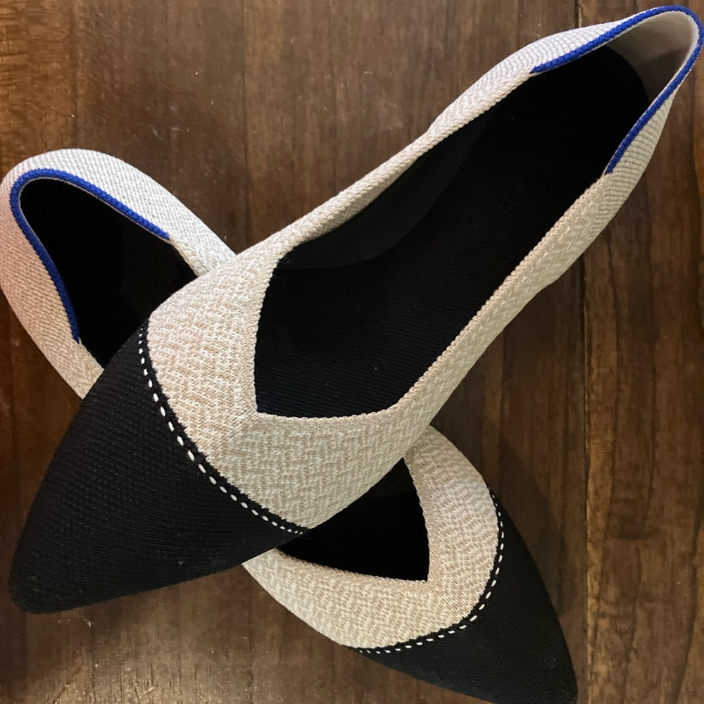 Rothy’s black and tan pointy-toed flats in EUC